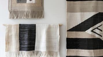 In the second image a trio of smaller woven wall hangings are displayed in a staggered formation. Each piece features a different geometric pattern in shades of black and white creating photo
