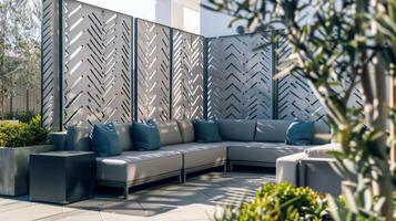 The seating area is divided by a series of geometric concrete screens each with a unique pattern etched into its surface. From intricate herringbone to bold chevron these concrete photo