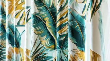 The curtains are made of a lightweight fabric with a largescale print of tropical flowers and giant palm leaves in shades of teal and gold. The bold pattern adds a touch of luxury photo