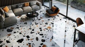 With an eyecatching contrast of colors the canvas displays a terrazzo floor in shades of black white and gray. The surface is adorned with a mixture of intricate patterns and bold photo