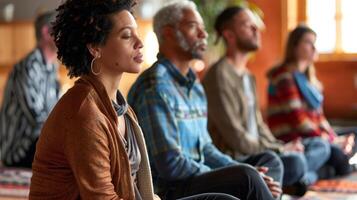 A group of individuals sitting in a meditation room participating in a mindful listening workshop photo