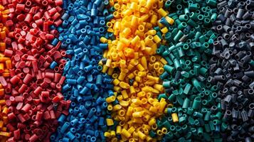 A collection of colorful recycled plastic pellets each labeled with the type of waste material it was made from representing the commitment to environmentally friendly sourcing photo