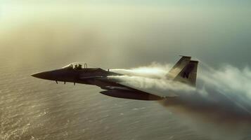 A military fighter jet zooms through the air leaving a trail of vapor in its wake as it makes a quick ascent photo