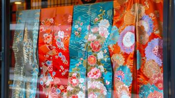 A shop window display featuring luxurious kimono fabrics and accessories drawing in tourists and locals looking for special souvenirs during Golden Week photo