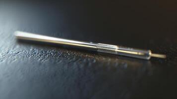A macro photo of a single acupuncture needle magnified to show its intricate details and construction highlighting the precision and skill required for proper placement i