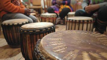 Thick hides stretched tightly over the drums frame creating the deep resounding beat that permeates the room inviting participants to join in the healing rhythm photo