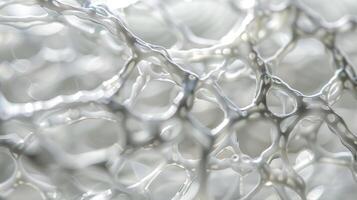 A closeup of a crystalclear membrane with a delicate pattern of cells visible underneath. This biocompatible material is used to create contact lenses providing a comfortabl photo