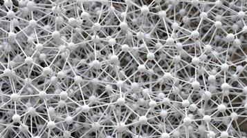 A topdown view of the aerographites network revealing the repetitive and symmetrical nature of its design. The strands and nodes are evenly spaced creating a visually appealin photo