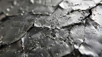 A detailed view of a thin film of piezoelectric material showing its bumpy surface and microscopic cracks that allow for the efficient conversion of mechanical energy int photo
