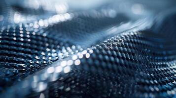 A closeup of a thin flexible film coated in tiny densely packed nanomaterials. The chemical composition of the film is a mix of carbon silicon and other proprietary component photo