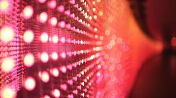 A series of blurred lights in motion captured by a long exposure photograph of an experimental light show at a sonic art exhibit photo