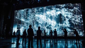 A projection mapping display covers a giant screen behind a stage showcasing intricate animations and visuals that accompany the music perfectly. The projections create photo