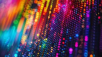 A magnified image of a pixel on a quantum dot display showing the individual red green and blue quantum dots that make up the subpixels. These tiny dots work in tandem t photo
