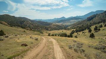A scenic ride through the mountains with breathtaking views of rolling hills and distant peaks photo