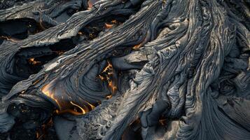 Streams of lava create intricate patterns as they carve their way down the mountain photo