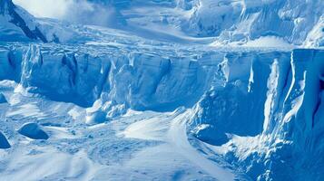 The icy surface of the glacier is adorned with deep blue crevasses hinting at the immense pressure held within photo