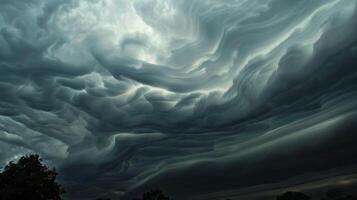 The air is thick and heavy under these unique cloud formations photo