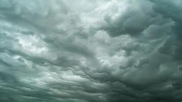 The smooth constrictive clouds stand in stark contrast to the dark turbulent sky photo
