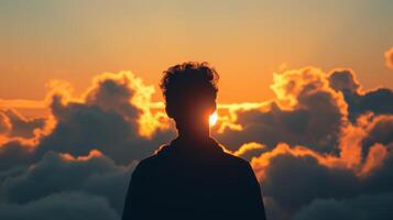 A humanlike shape seemingly born of the clouds its shadow stretching as far as the eye can see photo