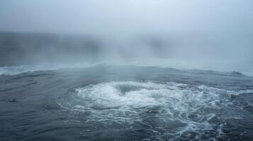 A hazy mist rises from the center of the whirlpool giving it an almost mystical aura photo