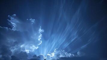 Soft glowing clouds lighting up the night sky creating a striking and rare display for those who witness it photo