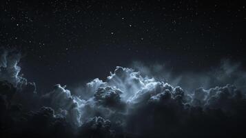 A dark yet captivating scene of the night shining clouds adding an extra layer of mystique to the universe photo