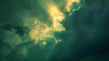 Shades of lime mint and jade illuminate the sky as the suns final rays pierce through the clouds photo