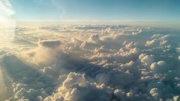 The view from a plane window with pyrocumulus clouds stretching out as far as the eye can see photo