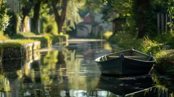 A small boat floating lazily on the calm waters of the canal photo