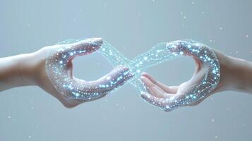 An infinity symbol formed by two linked hands with each hand representing a different entity in the healthcare system illustrating the continuous and seamless integration of patien photo