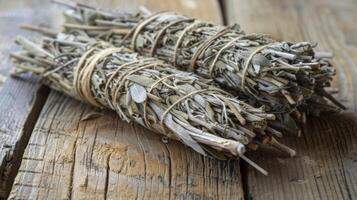 A bundle of dried sage tied with twine known for its reputation as a natural bug repellent during outdoor gatherings photo