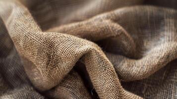 The color of the fabric varies from light beige to dark brown giving the texture a natural and earthy feel photo