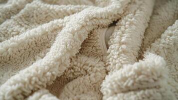 A detailed look at the pockets of the bathrobe where the fuzzy fabric is slightly flattened from wear. Despite its use the texture remains just as soft and comforting as the day i photo