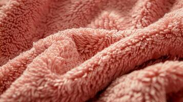 The texture of the bathrobe appears luxurious and decadent with its intricate weave of fine fibers. Its a delight to touch and wear inviting you to indulge in its fuzzy embrace photo