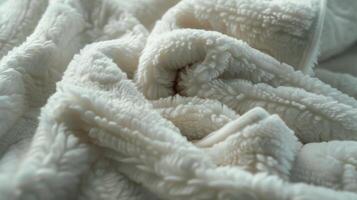A detailed view of the collar of a bathrobe with its densely packed fuzzy fabric. The texture is reminiscent of a bears fur inviting you to wrap yourself up in its warmth photo
