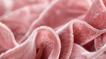 A closeup image of a dusty rose velvet ribbon showcasing its soft plush texture and intricate design photo