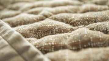 The smoothness of this quilted fabric is enhanced by the small tufts of fabric that peek through the stitching photo