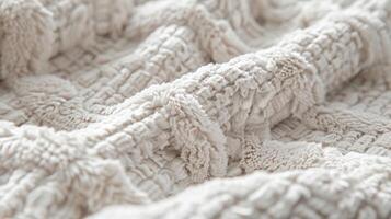 The intricate crisscross pattern of a plush chenille throw each crossed thread creating a plush and tactile surface photo