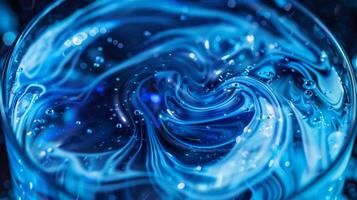 Soft swirling patterns of neon blue liquid fill a compact vial evoking a sense of otherworldly energy photo