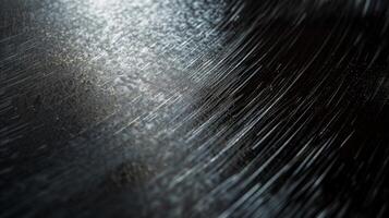 Fine scratches and swirl marks adding a matte quality to the dark metallic sheen of this anodized aluminum photo