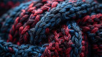 A rich vibrant knit texture in shades of deep navy and burgundy with a subtle shimmer and softness that adds a touch of elegance to a winter hat photo