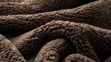 A zoomedin image of a sherpa fleece material in a deep chocolate brown color conveying a softness and warmth that is both inviting and luxurious photo