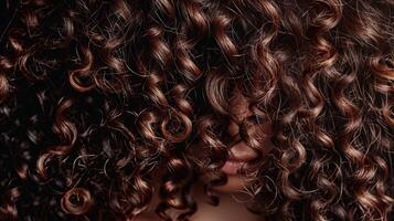 A of thick curly strands overlapping each other creating a mesmerizingly layered effect photo