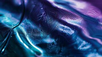 The texture of a polished metal alloy shimmering with a mix of deep blues purples and greens evoking a sense of modern technology and innovation photo