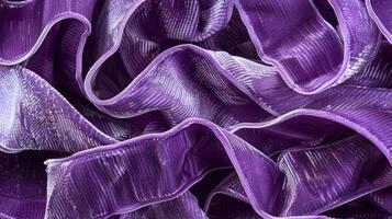 A purple velvet ribbon with a unique crinkle texture adding depth and dimension to the fabric photo