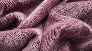 Closeup of a mauve flannelette with a subtle woven pattern demonstrating its velvety feel and brushed appearance photo