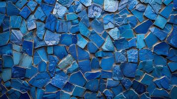 Rough Mosaic Texture The closeup highlights the intricate and uneven texture of small mosaic tiles in varying shades of blue creating a tactile and visually interesting surface photo