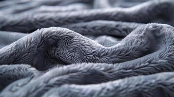 As you run your fingers through the blankets surface you feel the gentle ridges and valleys of the thick fleece fabric adding to its softness photo