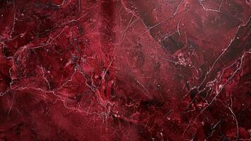 A closeup of a rectangular glazed ceramic tile boasting a rich burgundy hue with a high shine and a subtle marbled effect throughout photo