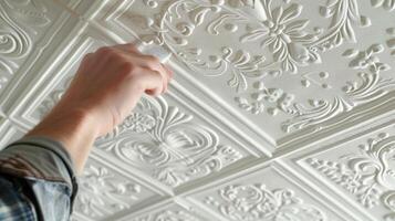 Luxurious Relief This embossed ceiling tile boasts a luxurious relief texture with raised details that catch the light and add a touch of opulence to any space photo